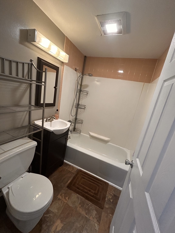 5 Manor Court, Unit 5 Springfield, MA 01118 - Photo 16 of 19 a bathroom with a toilet sink and mirror