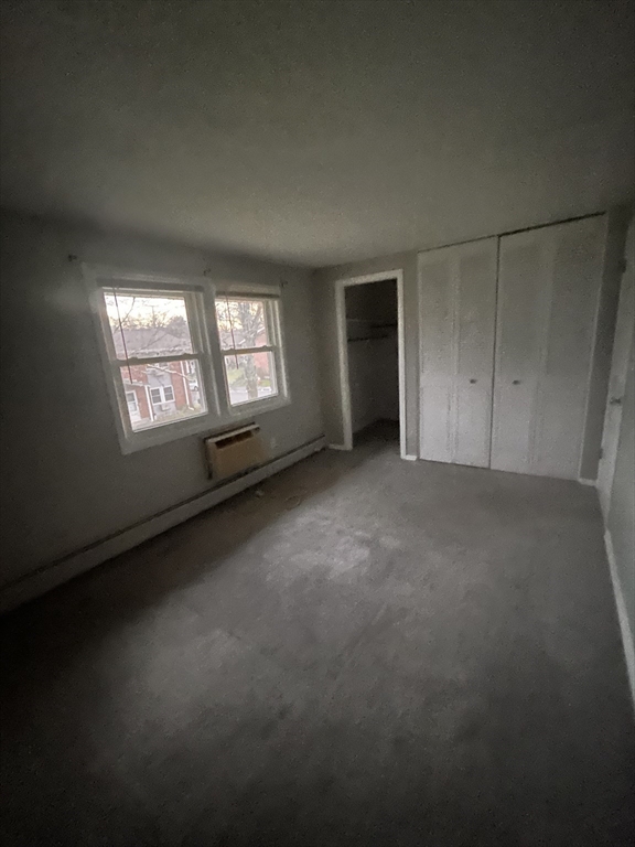 5 Manor Court, Unit 5 Springfield, MA 01118 - Photo 17 of 19 an empty room with windows