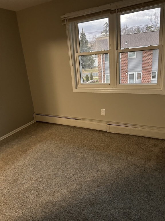 5 Manor Court, Unit 5 Springfield, MA 01118 - Photo 18 of 19 an empty room with a window