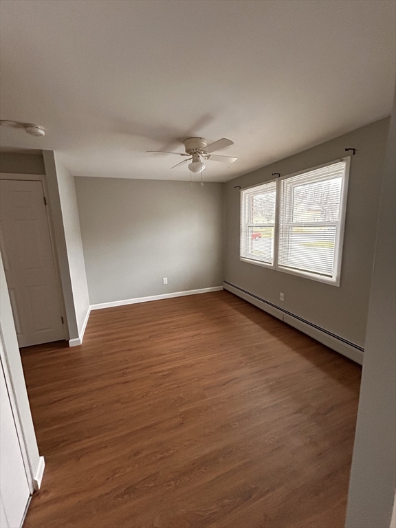 5 Manor Court, Unit 5 Springfield, MA 01118 - Photo 10 of 19 an empty room with wooden floor and windows