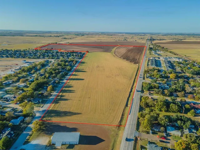 a view of a swimming pool and an outdoor seating