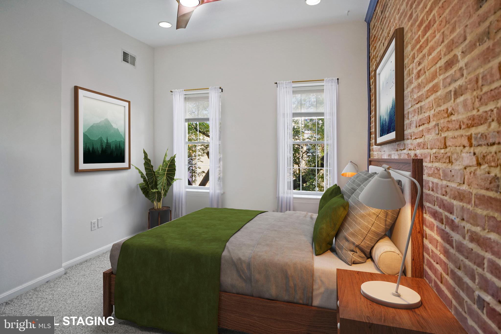 1417 Covington Street Baltimore, MD 21230 - Photo 12 of 25 Bright main bedroom with exposed brick walls