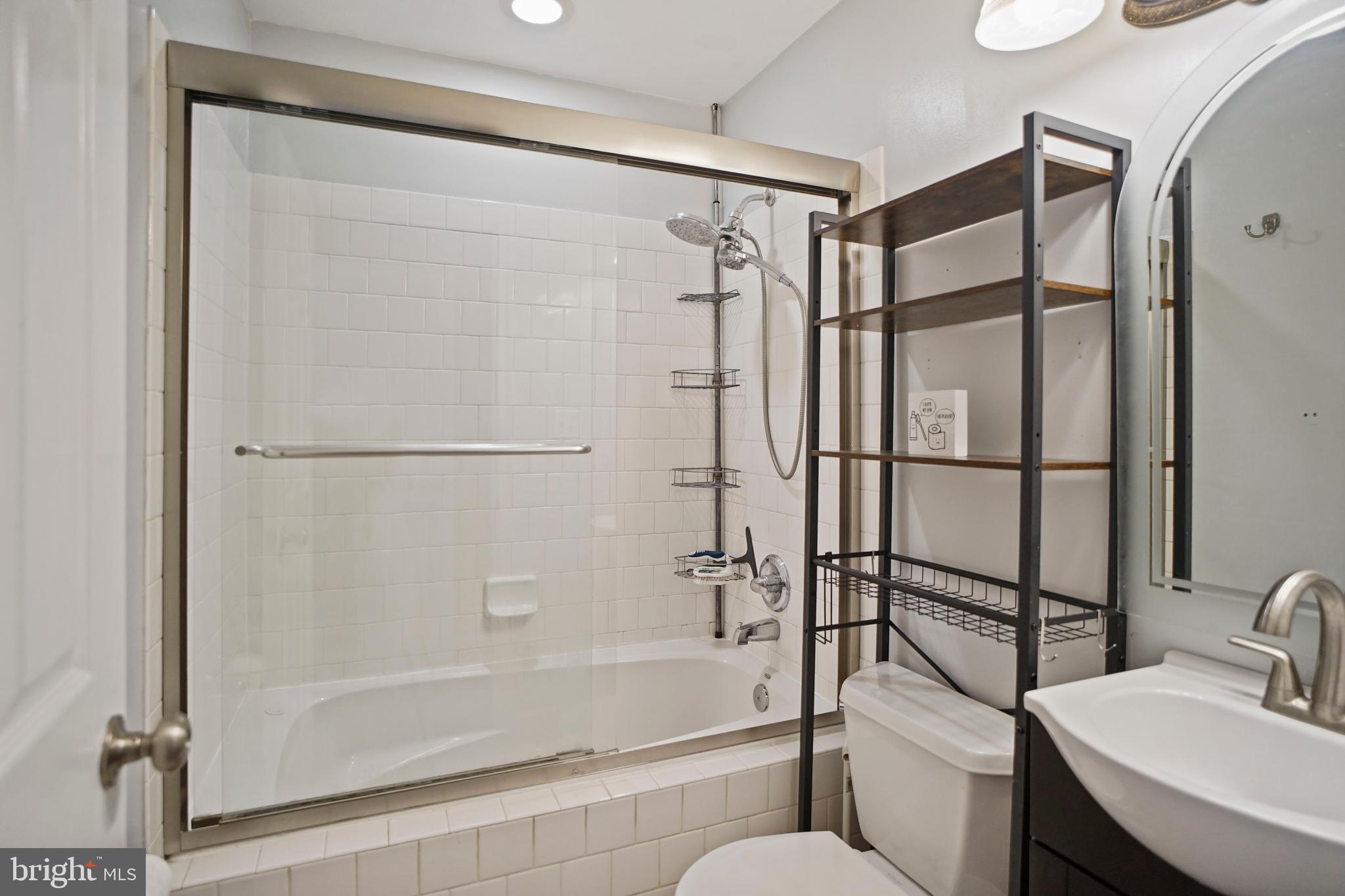 1417 Covington Street Baltimore, MD 21230 - Photo 19 of 25 Hallway bathroom with sleek fixtures