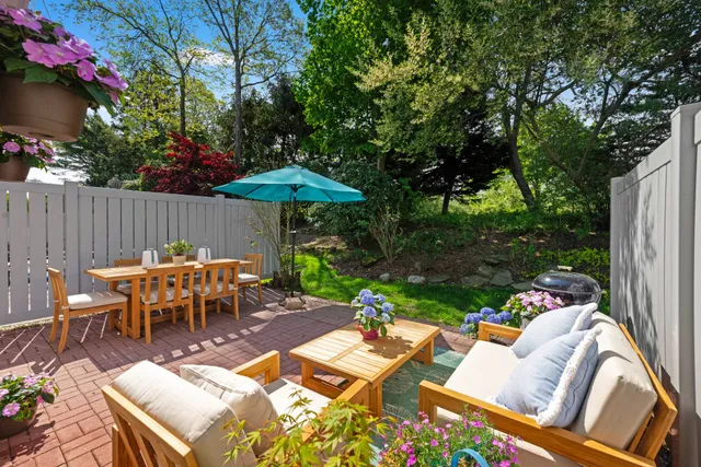 a view of a patio with furniture
