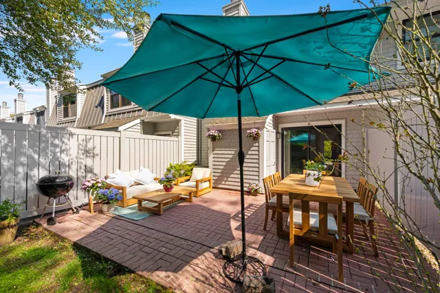an outdoor space with furniture and umbrella