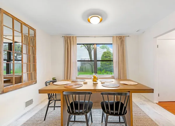 a view of a dining room with furniture window and outside view