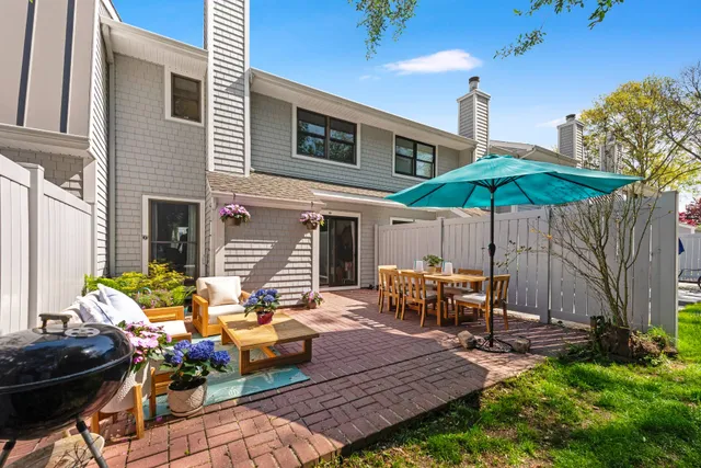 a view of a backyard with sitting area and furniture