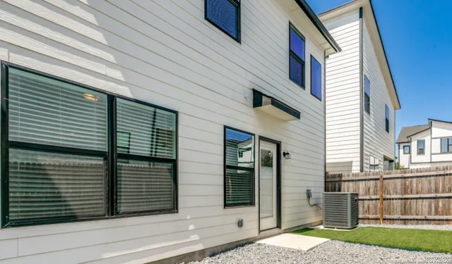 a view of a house with a door and a large window