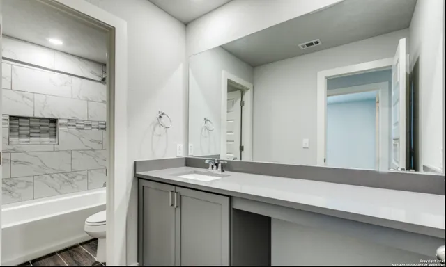 a bathroom with a sink and a bathtub