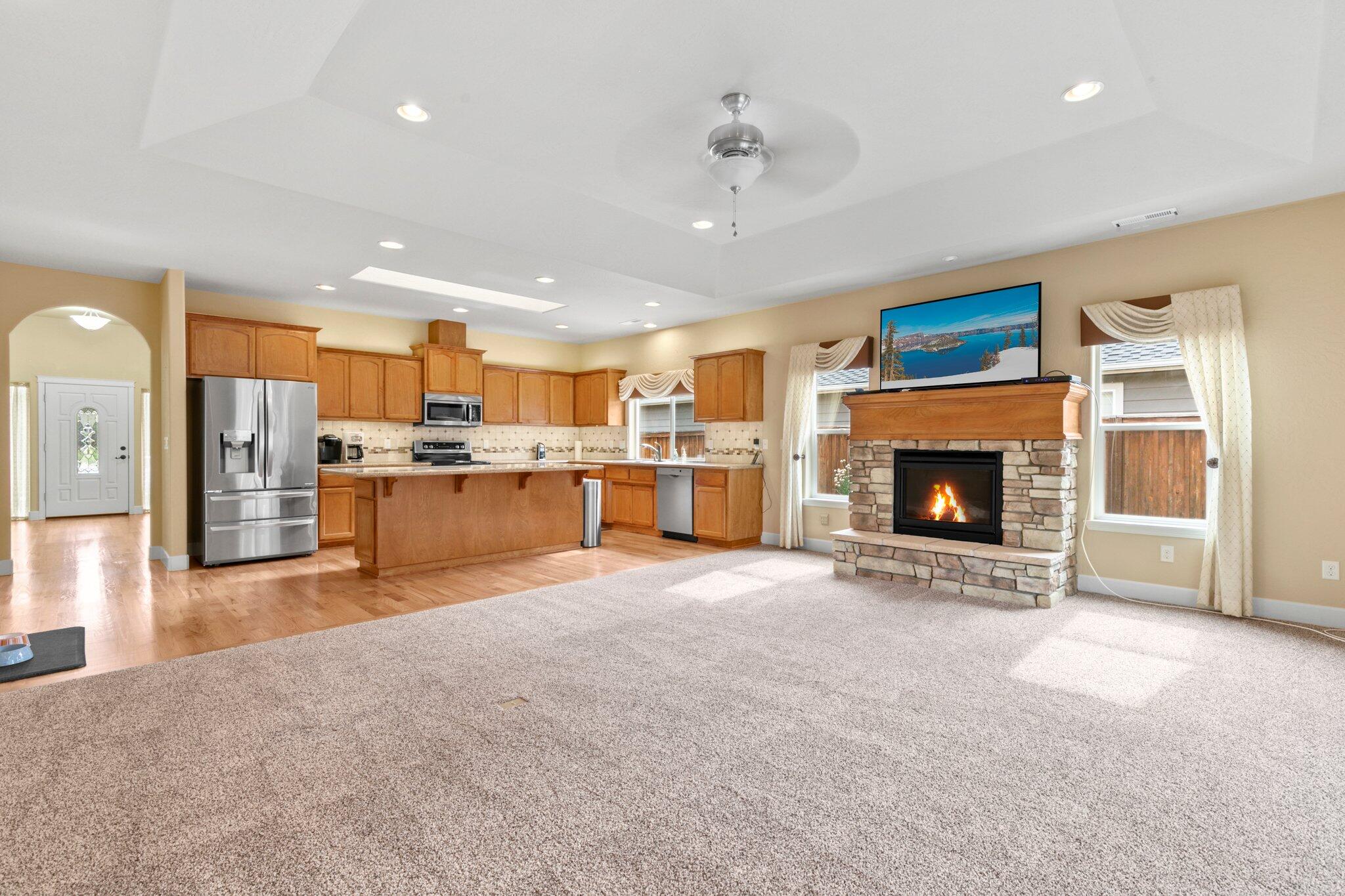 2165 Rabun Way Central Point, OR 97502 - Photo 7 of 28 a view of a kitchen with a sink and a fireplace