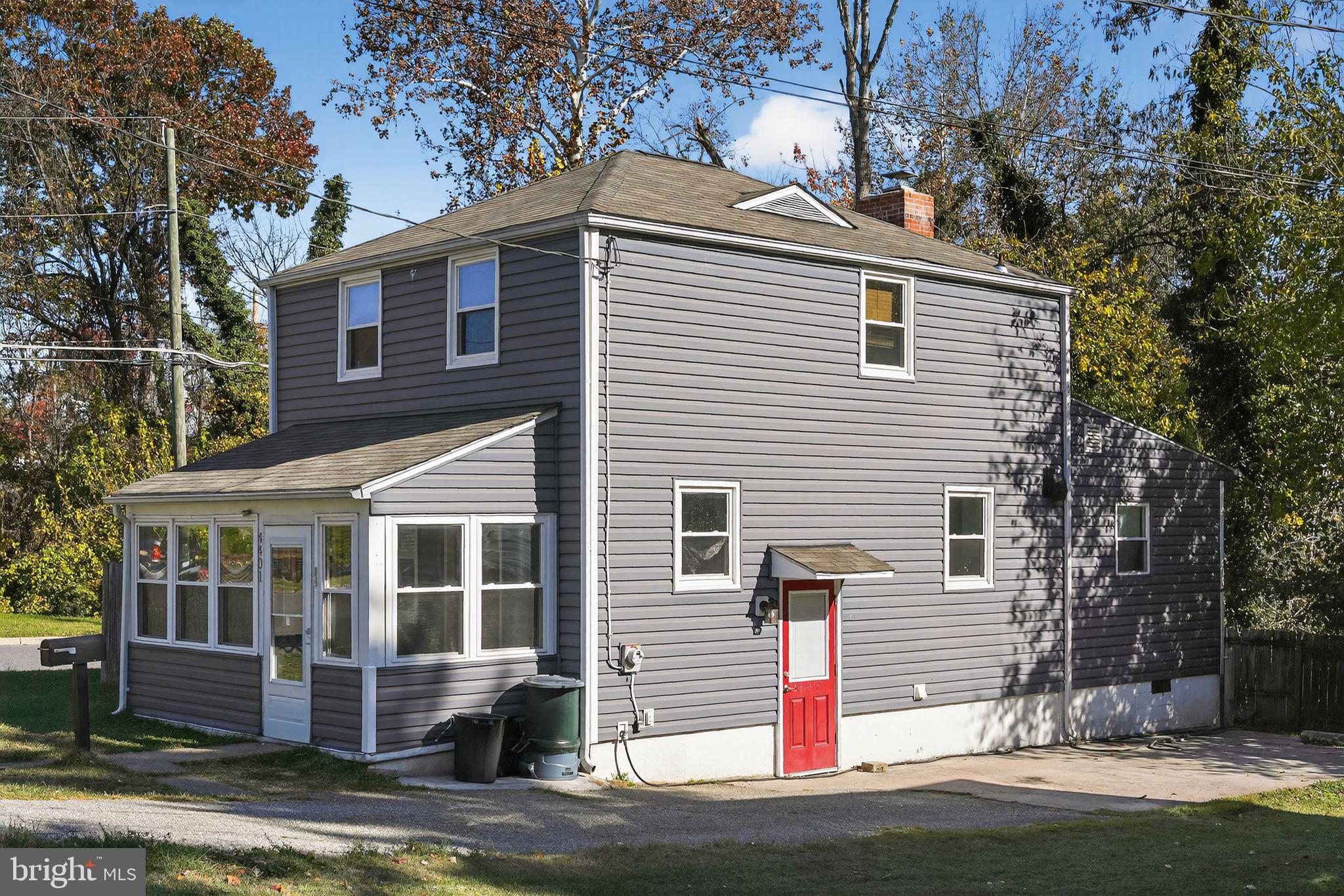 4401 Ridge Drive Baltimore, MD 21229 - Photo 2 of 30 a front view of a house with a yard