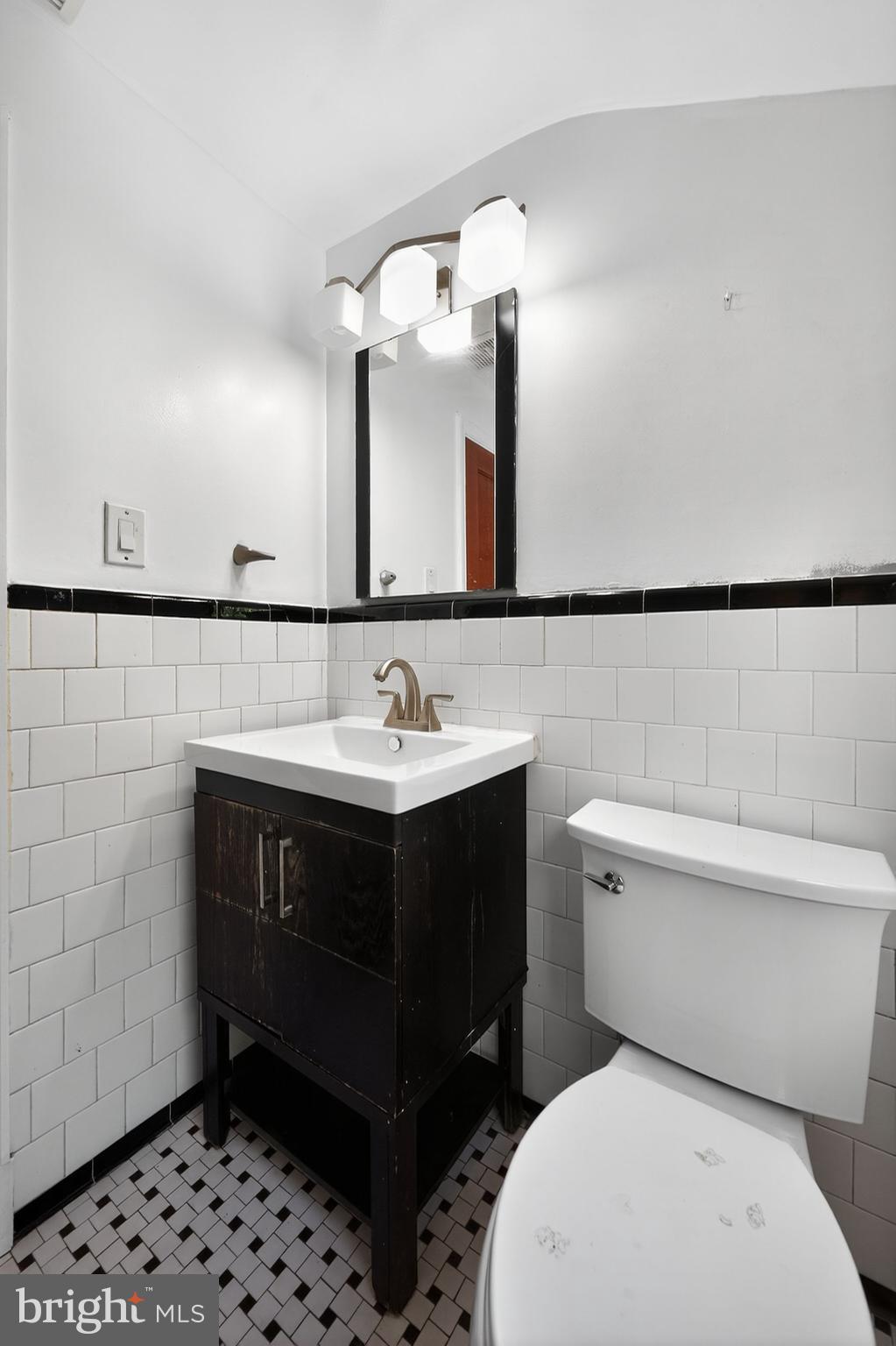 4401 Ridge Drive Baltimore, MD 21229 - Photo 24 of 30 a bathroom with a sink vanity and toilet