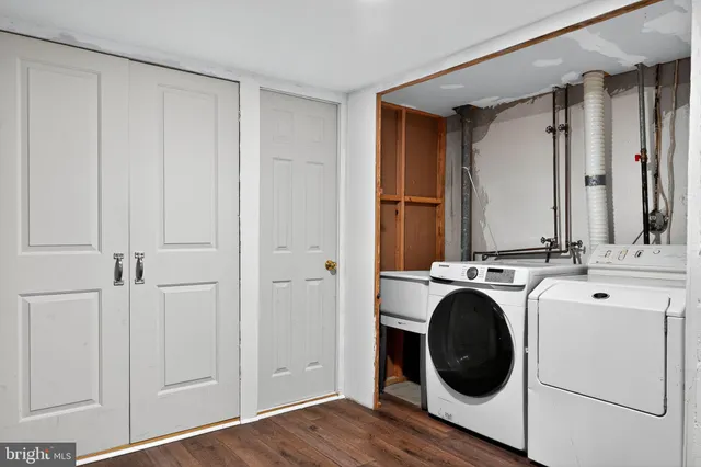 a view of a hallway with washer and dryer