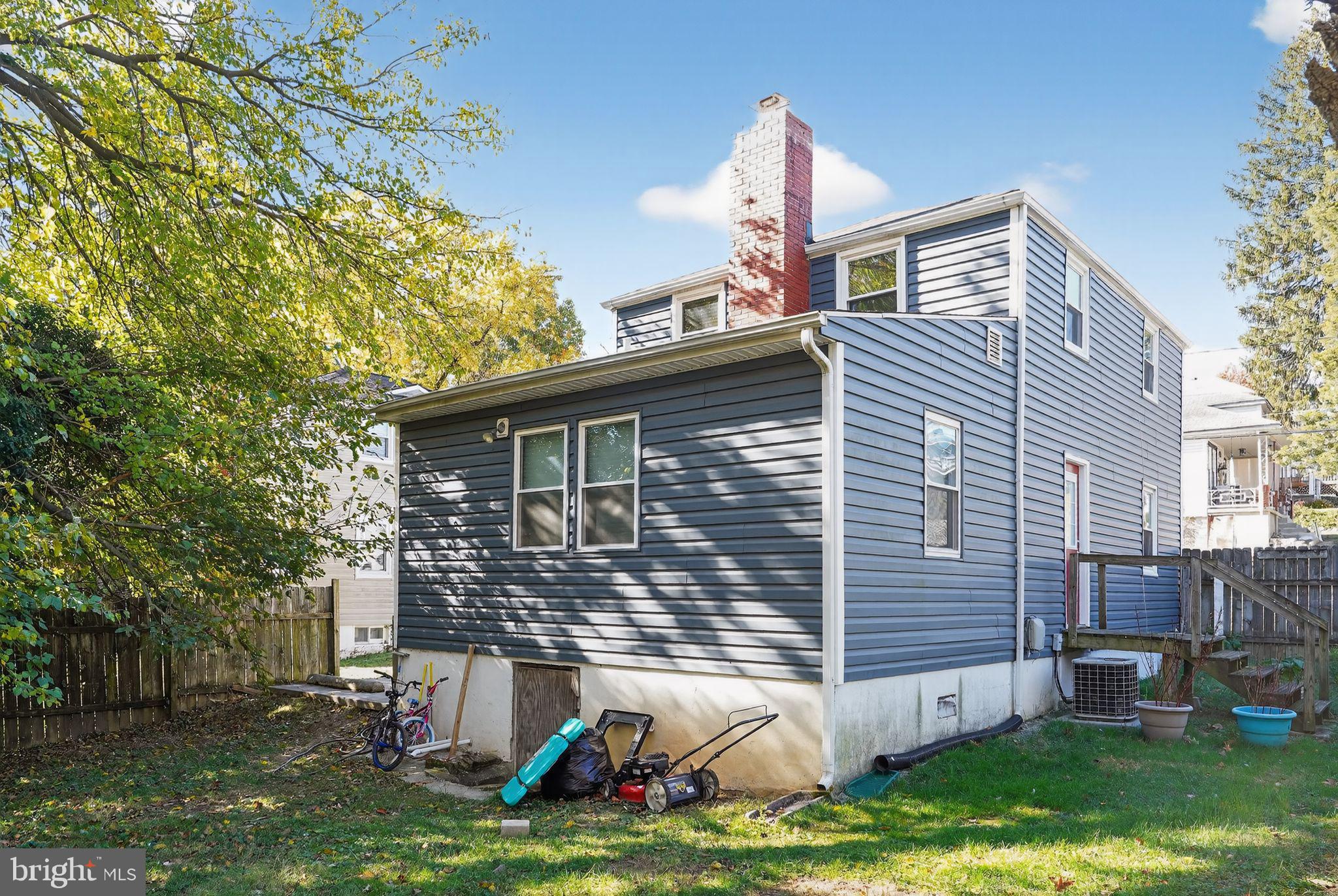 4401 Ridge Drive Baltimore, MD 21229 - Photo 29 of 30 a front view of a house with a yard