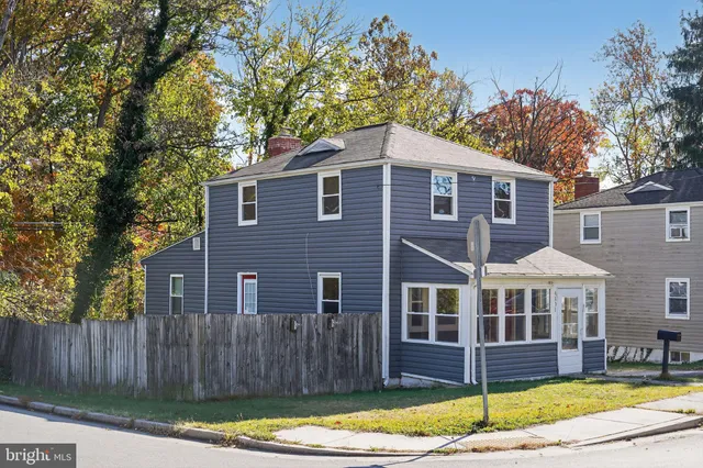 a front view of a house with a yard balcony