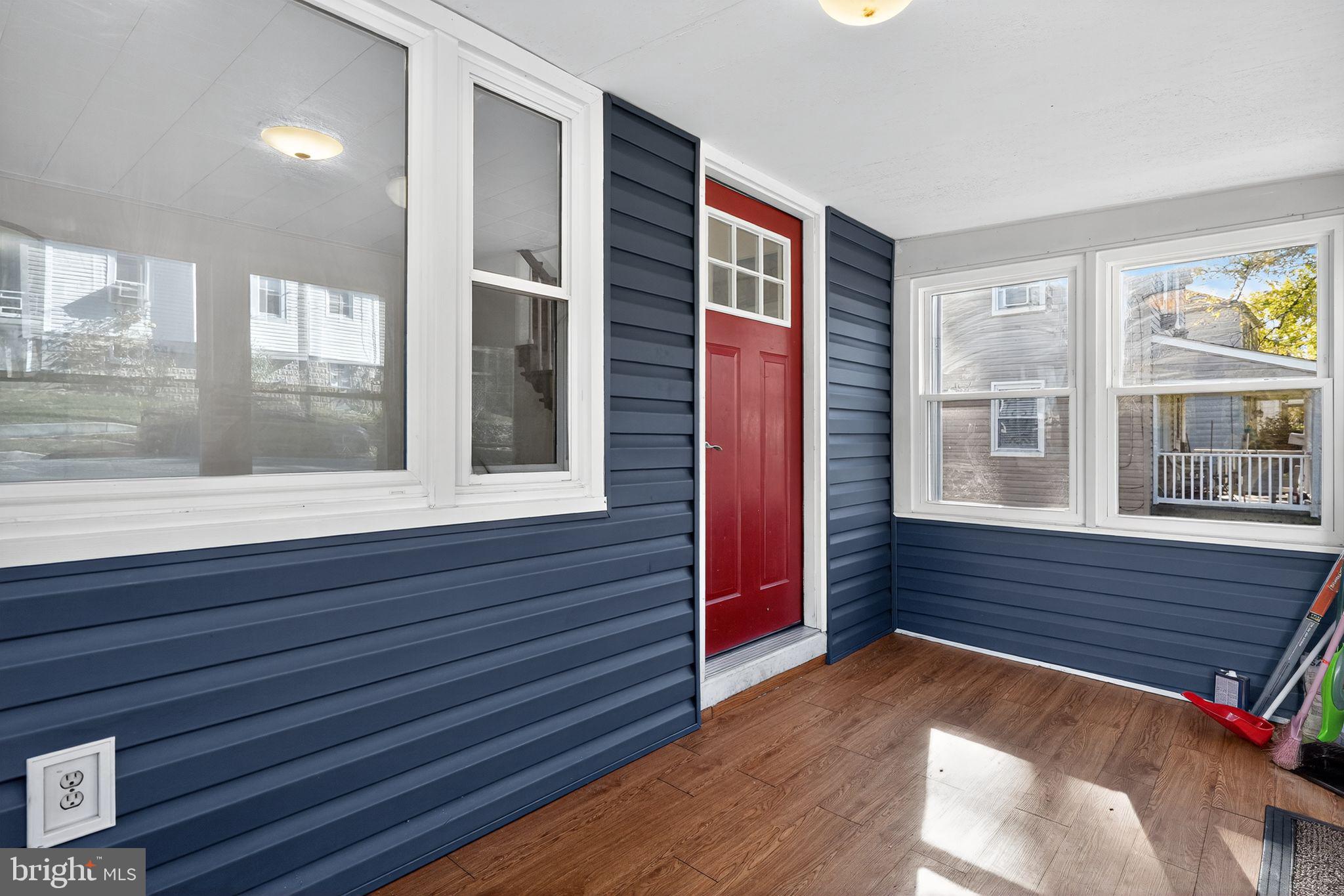 4401 Ridge Drive Baltimore, MD 21229 - Photo 4 of 30 a view of wooden floor and windows in a room