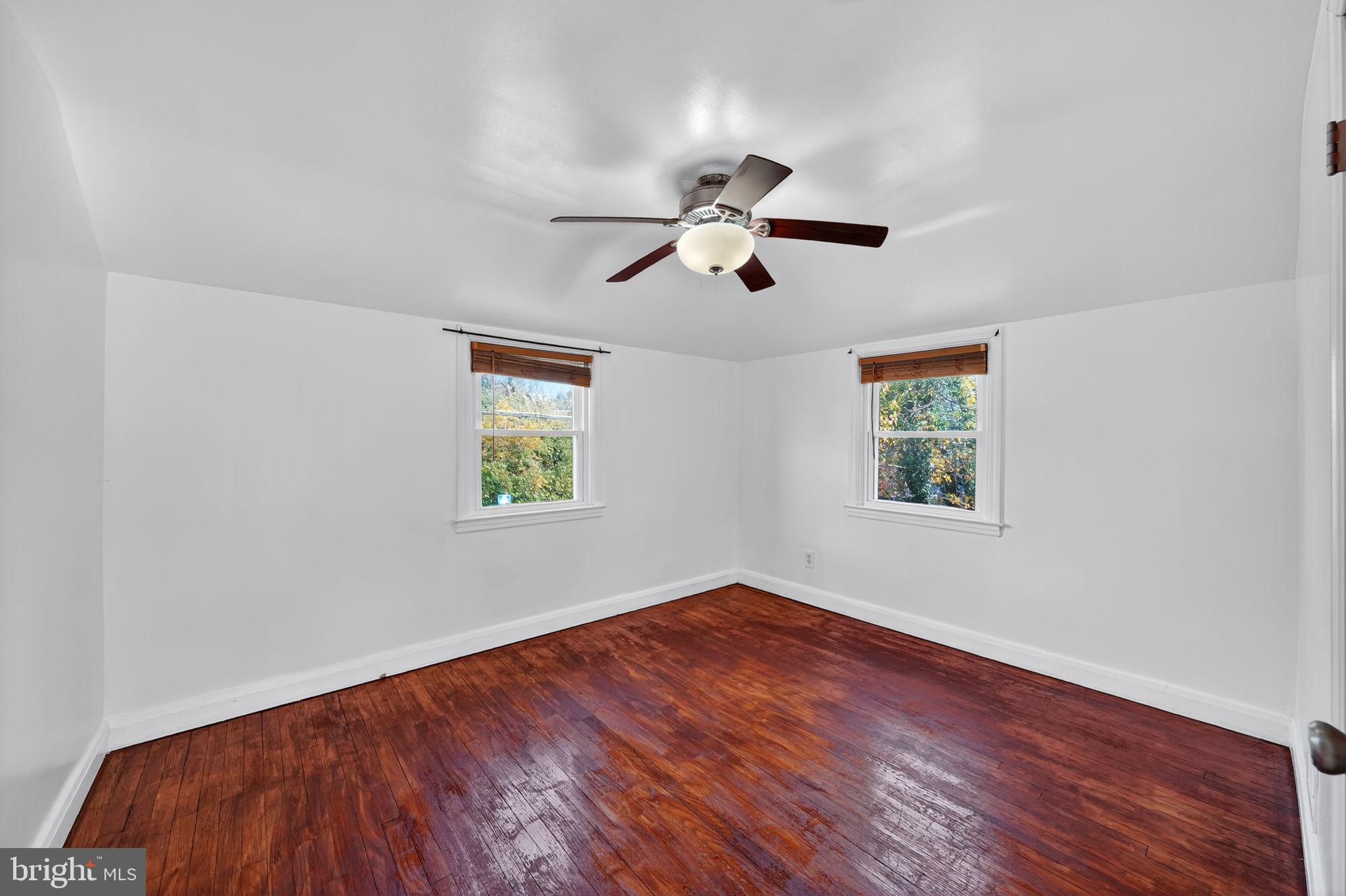 4401 Ridge Drive Baltimore, MD 21229 - Photo 9 of 30 a view of empty room with wooden floor