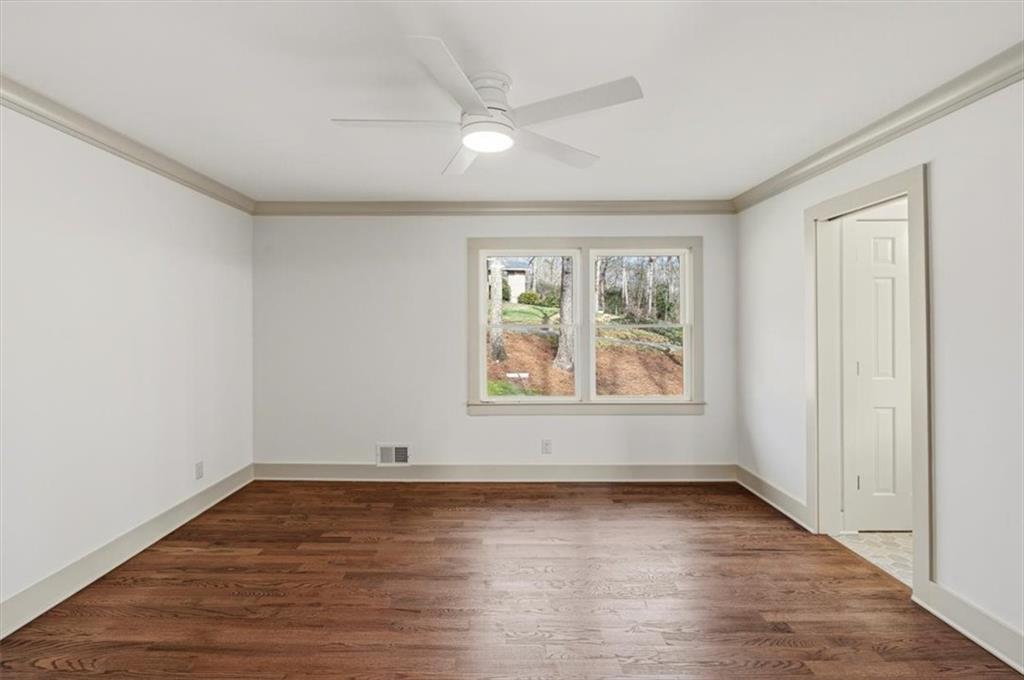 49 Apache Trail Cartersville, GA 30120 - Photo 30 of 52 an empty room with wooden floor and windows