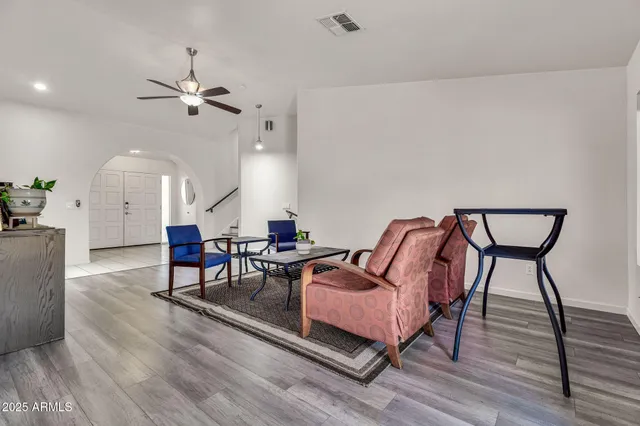 a view of a dining room with furniture window and wooden floor