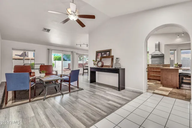 a view of a dining room with furniture and window