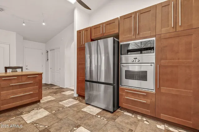 a spacious bathroom with a sink a mirror and a window