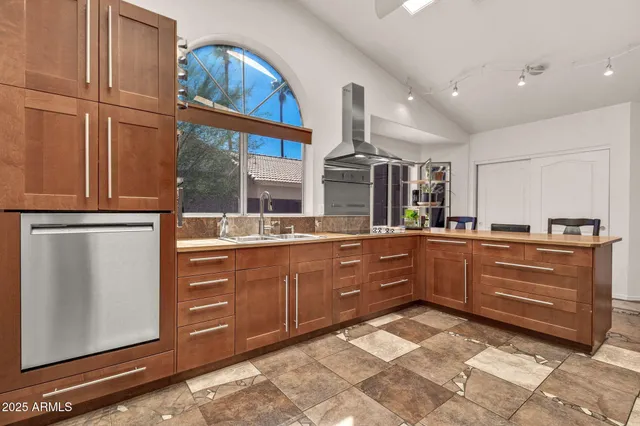 a spacious bathroom with a granite countertop sink toilet and shower