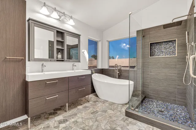 a view of a hallway with wooden floor and utility room