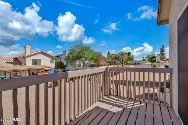 a spacious bedroom with two beds and a chandelier