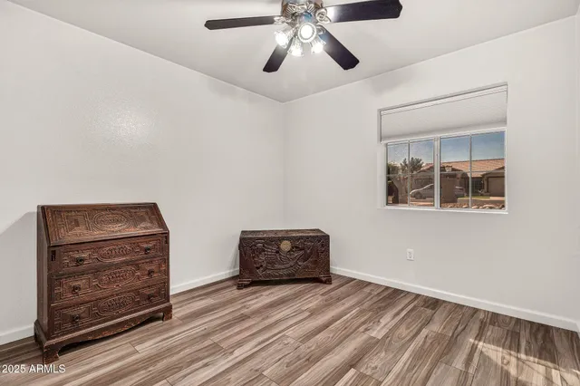 a bed room with a bed and a chandelier