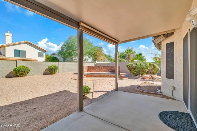 a view of a road with wooden fence