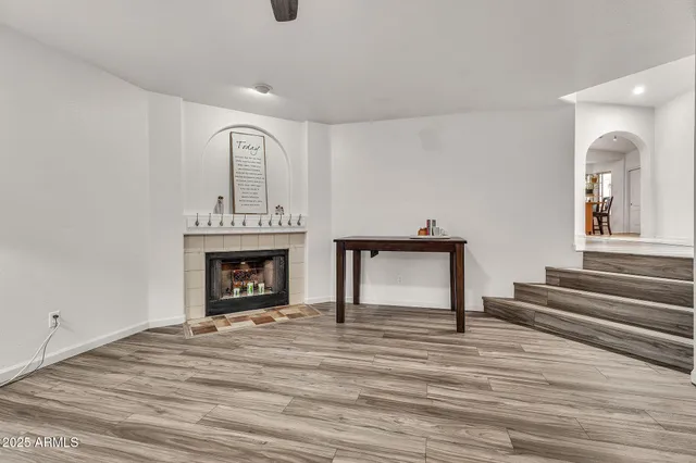 a view of workspace with wooden floor and ceiling fan