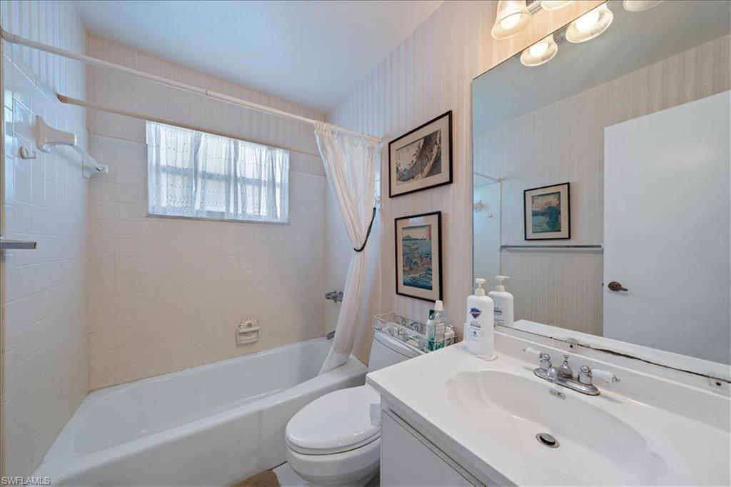 1069 Forest Lakes Drive, Unit 1B Naples, FL 34105 - Photo 23 of 29 a bathroom with a sink toilet and bathtub