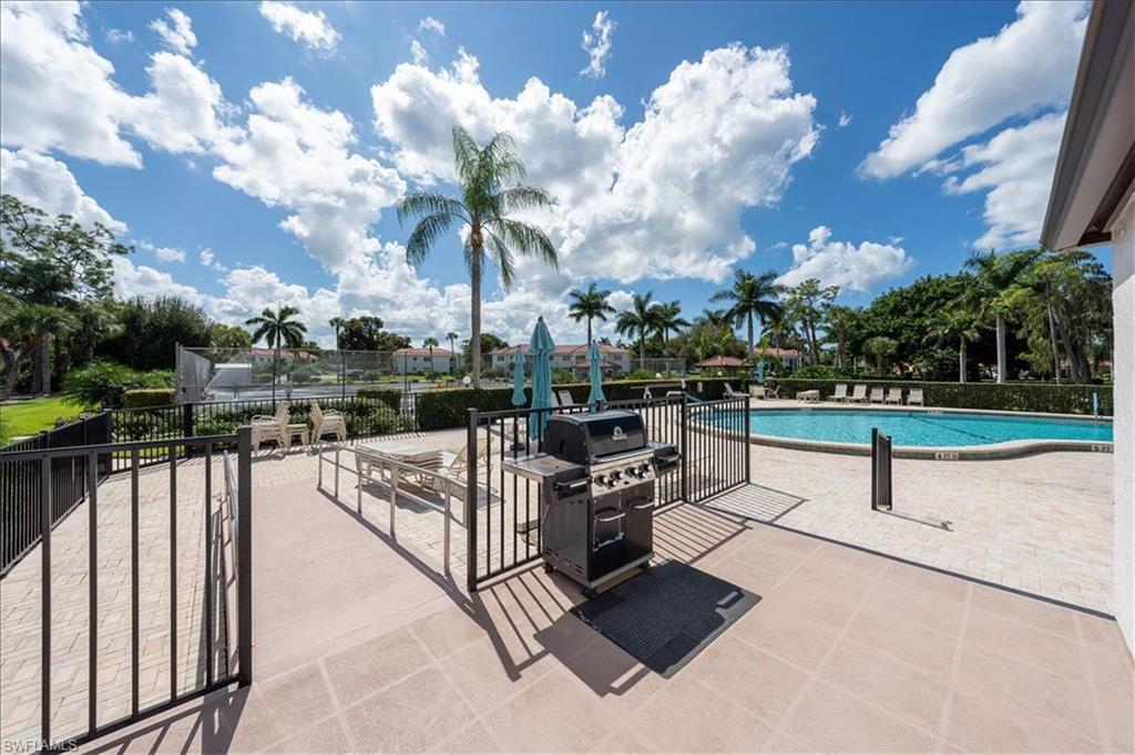 1069 Forest Lakes Drive, Unit 1B Naples, FL 34105 - Photo 27 of 29 a view of a terrace with sitting area