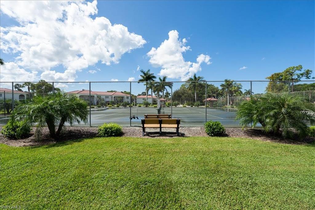 1069 Forest Lakes Drive, Unit 1B Naples, FL 34105 - Photo 28 of 29 a view of a garden in front of a house