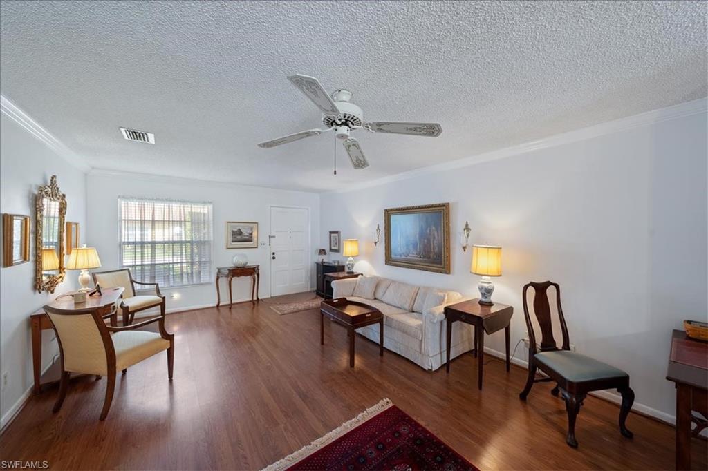 1069 Forest Lakes Drive, Unit 1B Naples, FL 34105 - Photo 8 of 29 a living room with furniture