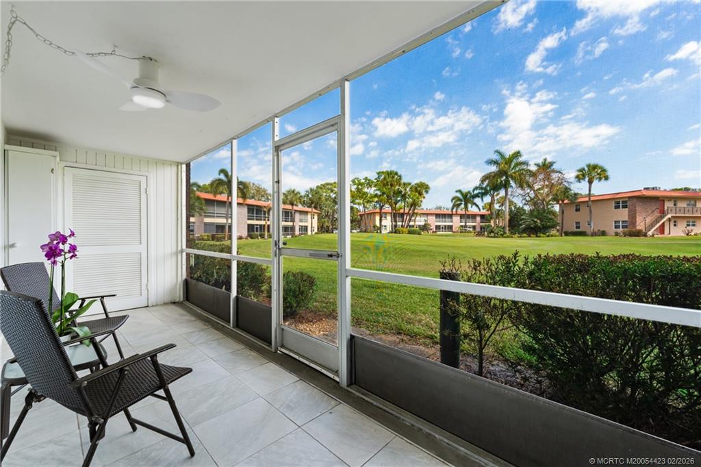 1903 Southwest Palm City Road, Unit C Stuart, FL 34994 - Photo 11 of 34 a view of a porch with furniture and garden