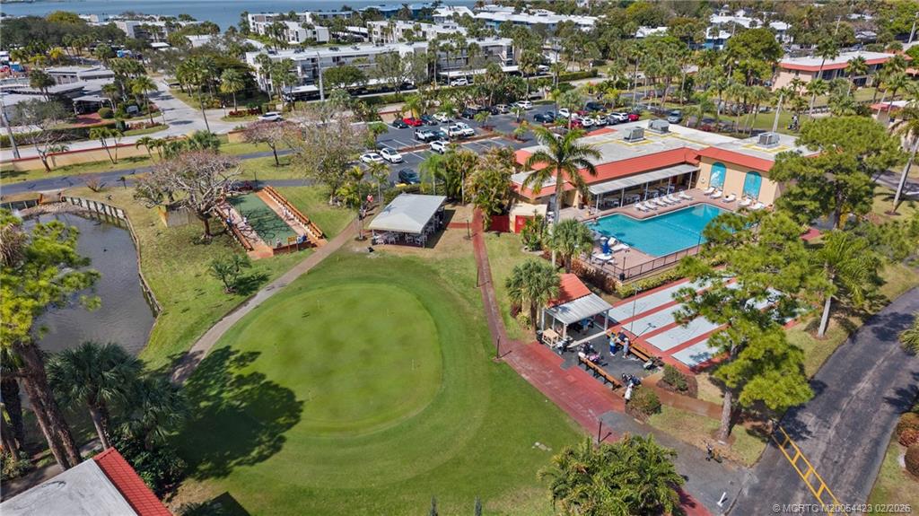 1903 Southwest Palm City Road, Unit C Stuart, FL 34994 - Photo 19 of 34 an aerial view of residential houses with outdoor space