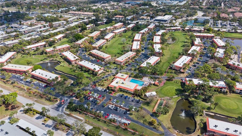 1903 Southwest Palm City Road, Unit C Stuart, FL 34994 - Photo 21 of 34 an aerial view of residential houses with outdoor space