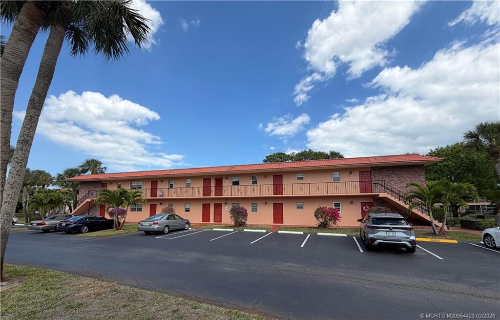 1903 Southwest Palm City Road, Unit C Stuart, FL 34994 - Photo 24 of 34 a cars parked in front of a building
