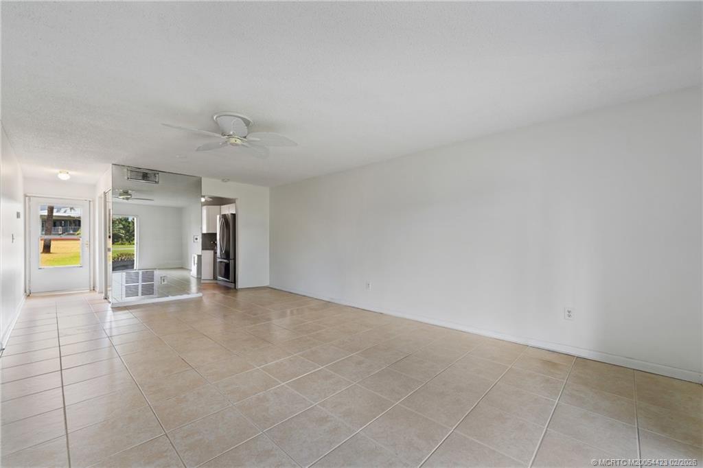 1903 Southwest Palm City Road, Unit C Stuart, FL 34994 - Photo 27 of 34 a view of an empty room with a window