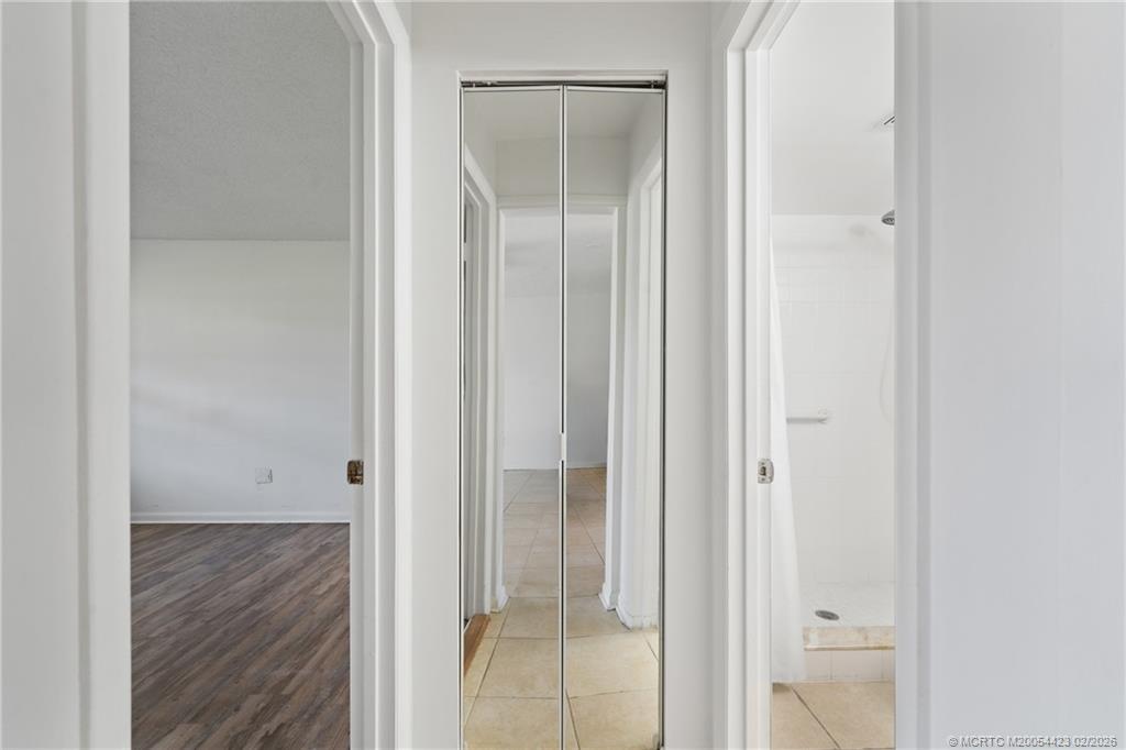 1903 Southwest Palm City Road, Unit C Stuart, FL 34994 - Photo 32 of 34 a view of a bathroom from a hallway