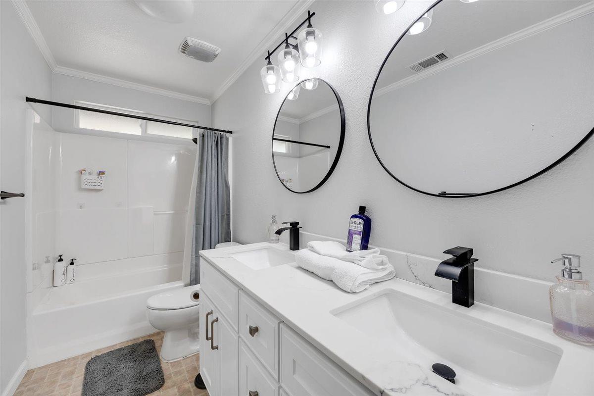 2441 Quail Hill Road Copperopolis, CA 95228 - Photo 39 of 91 Updated guest bath with quartz counters, new vanity, fixtures, and on-trend lighting and mirrors.