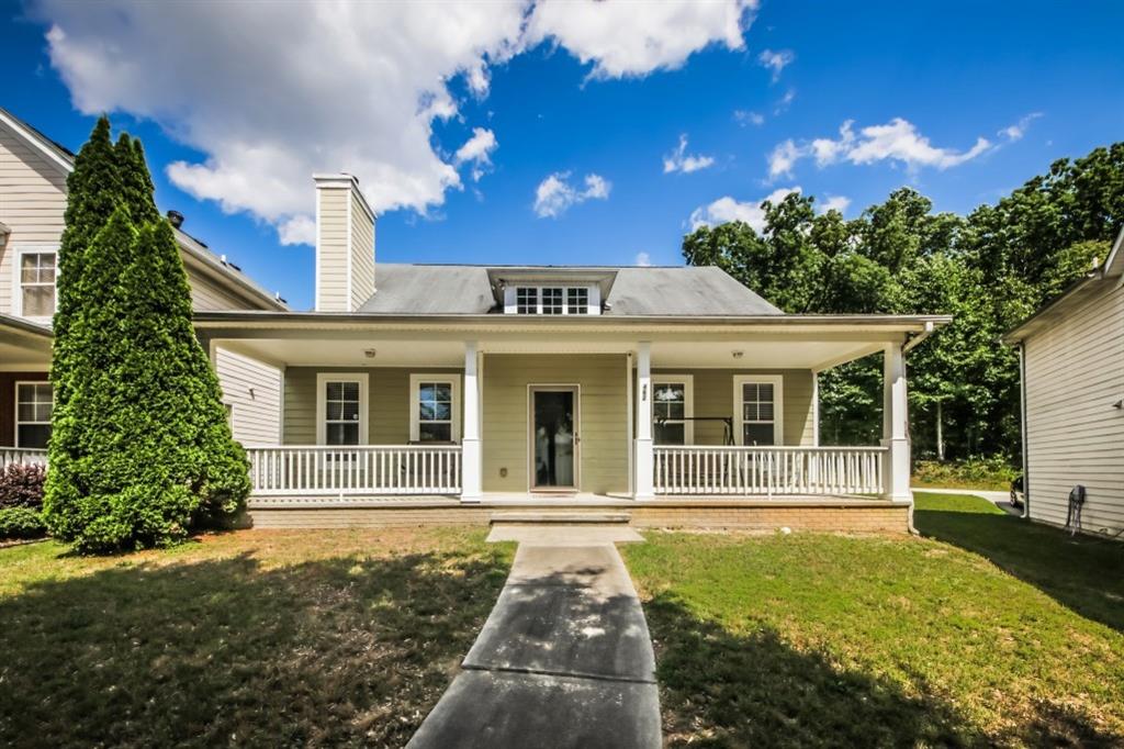 a front view of a house with a yard