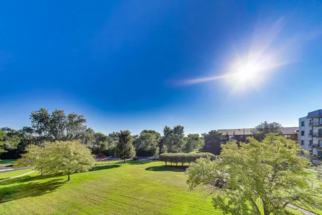 a view of a lake with houses in the background