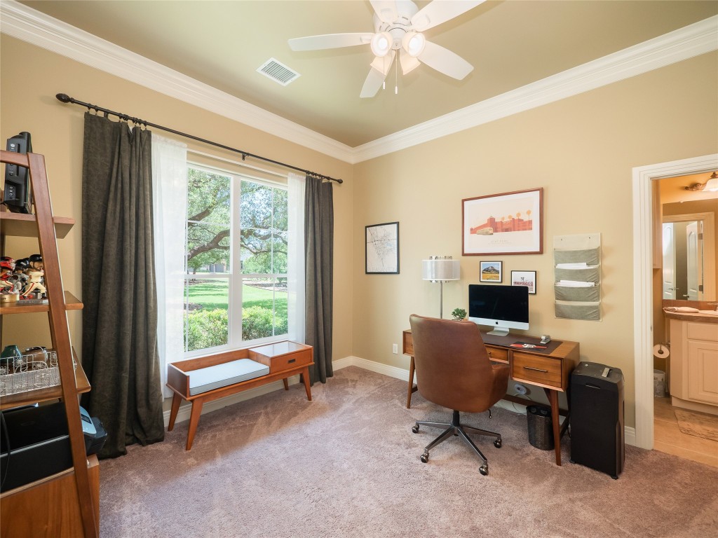 104 East Rustle Cove Georgetown, TX 78628 - Photo 16 of 40 a view of a livingroom with workspace and a window