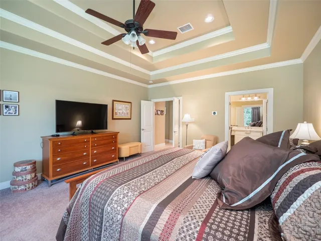 a bed room with a bed and a mirror