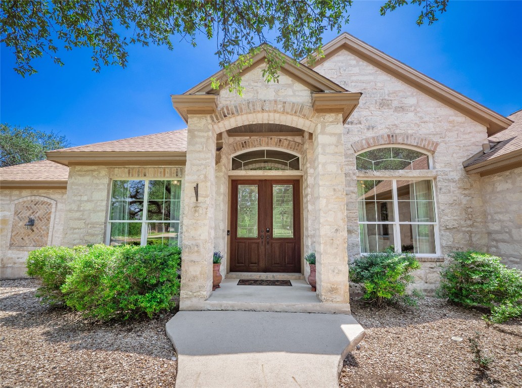 104 East Rustle Cove Georgetown, TX 78628 - Photo 2 of 40 a front view of a house with garden