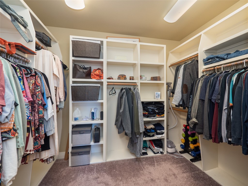 104 East Rustle Cove Georgetown, TX 78628 - Photo 21 of 40 a view of walk in closet with clothes and shoes