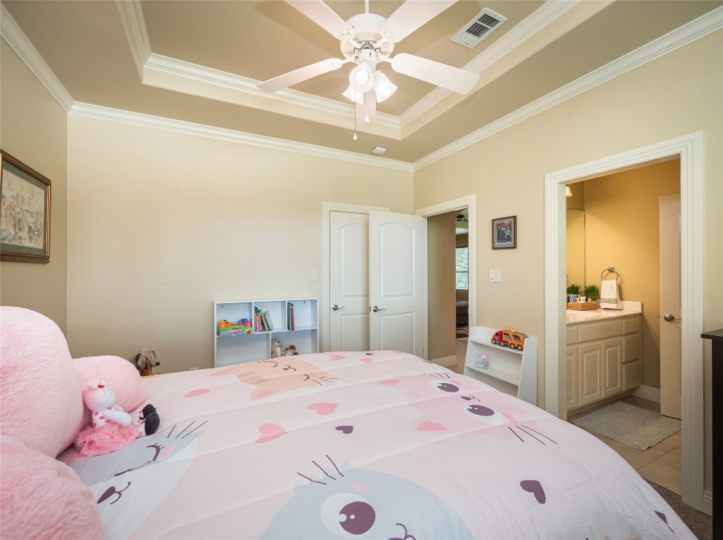 104 East Rustle Cove Georgetown, TX 78628 - Photo 22 of 40 a bed room with a bed and a mirror