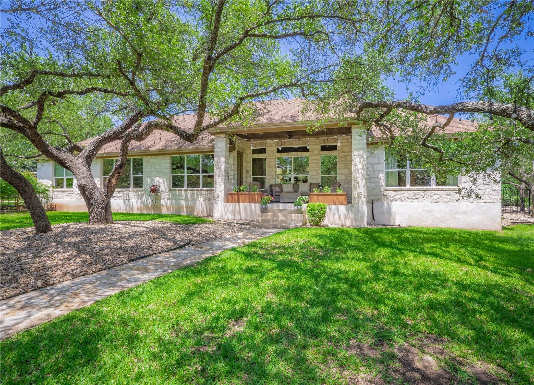 104 East Rustle Cove Georgetown, TX 78628 - Photo 30 of 40 a front view of a house with garden
